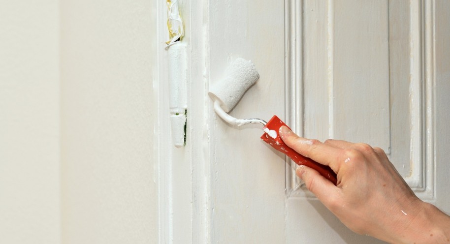 man painting the door; Caption: It's only natural that you'll want to decorate space according to your liking, but not every landlord will allow it