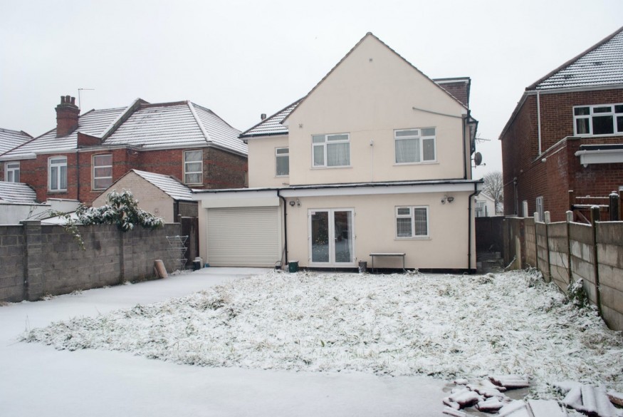 Suburban settlement cottages during snowy winter day